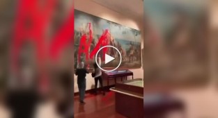 Eco-activists poured red paint on a painting of Columbus in Madrid