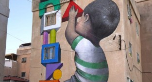 Художник-путешественник из Парижа и его добрые граффити в разных городах мира (18 фото)