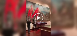 Eco-activists poured red paint on a painting of Columbus in Madrid